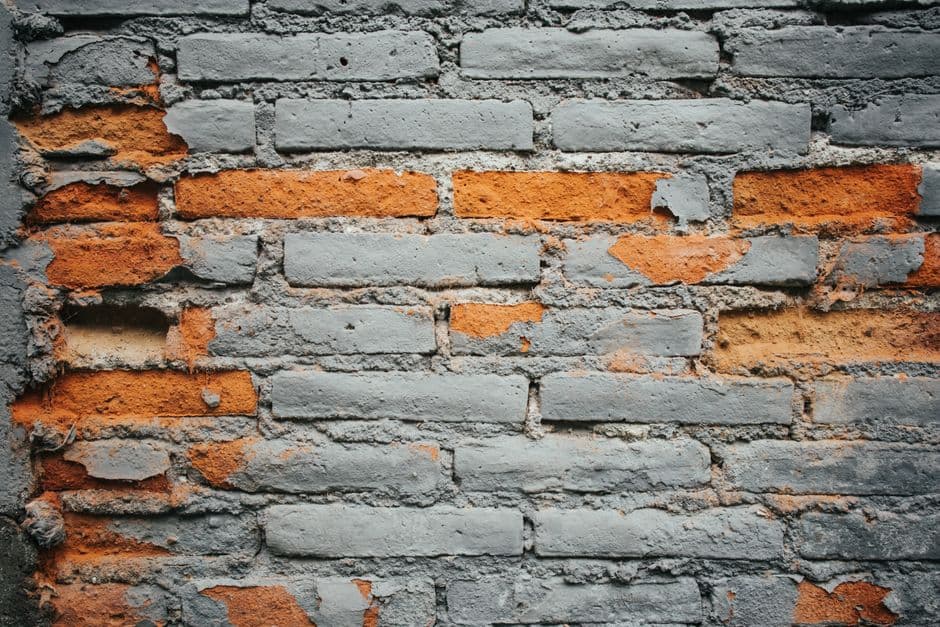 Detailed view of spalling brick damage on a Chicago residential wall