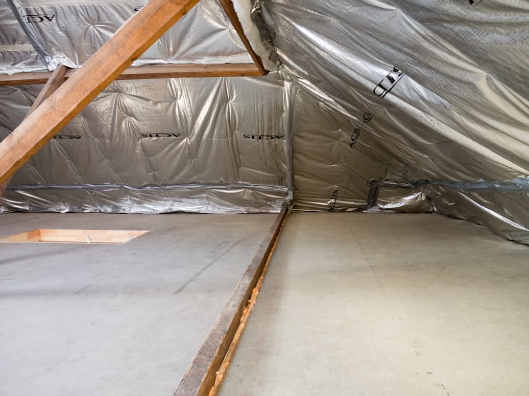 Garage conversion under construction showing insulation and framing